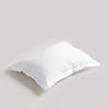 White pillow on a light gray background